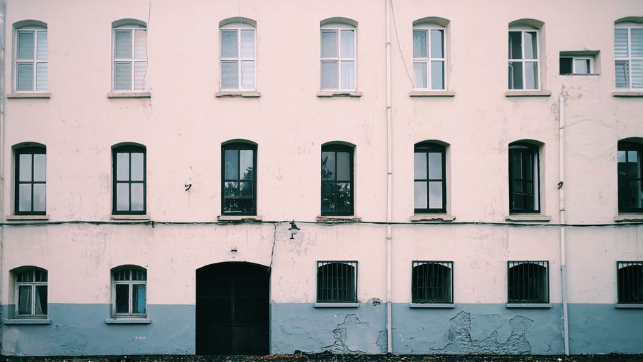 Painted house front with symmetrical windows