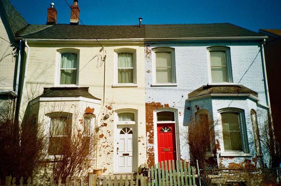 Painted brick houses with white and red doors