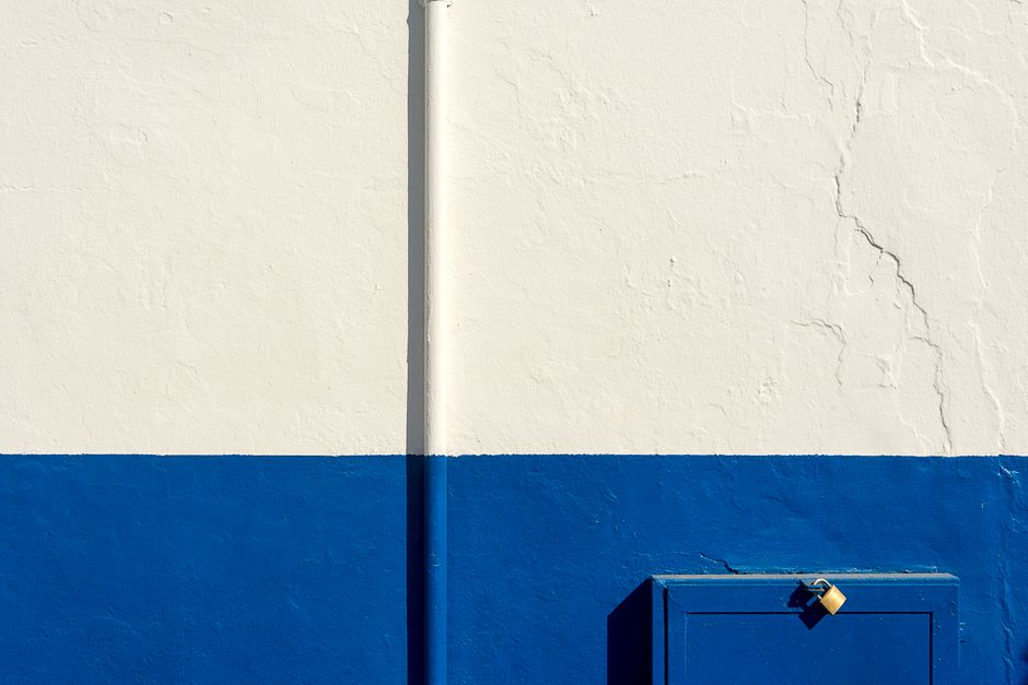 Painted wall with a metal padlock